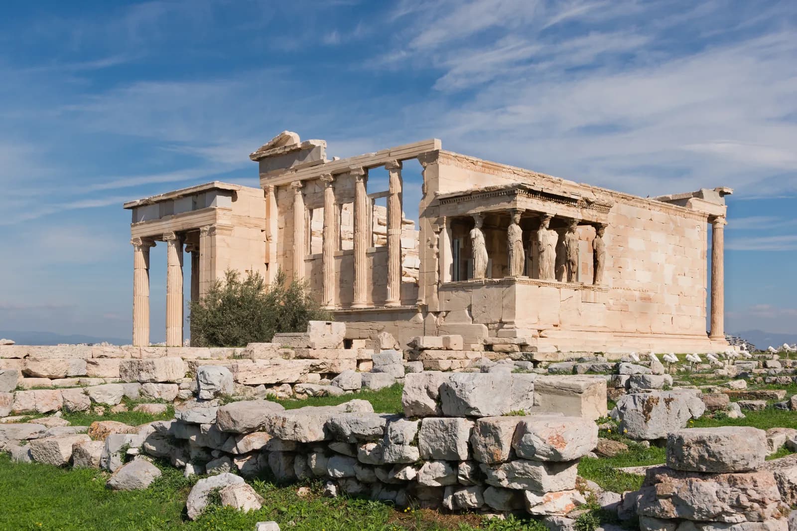The Erechtheum on the Athenian Acropolis, with the Porch of the Caryatids visible on the south side, Pentelic marble Ionic temple of the late 5th century BCE.