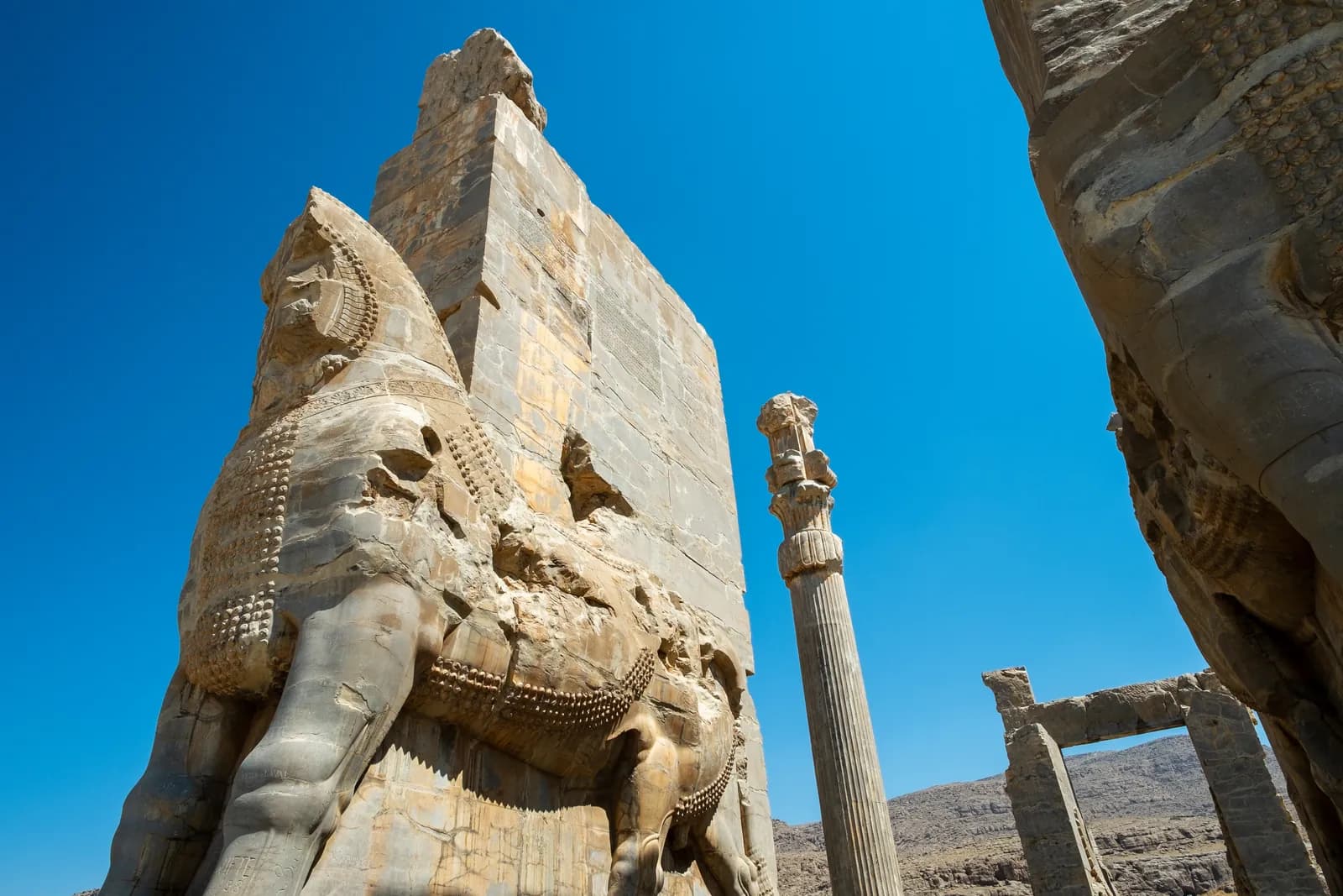 The Gate of All Nations at Persepolis, built under Xerxes I — the monumental gateway through which delegations of the empire's subject peoples entered the ceremonial capital, flanked by colossal lamassu (human-headed winged bulls).