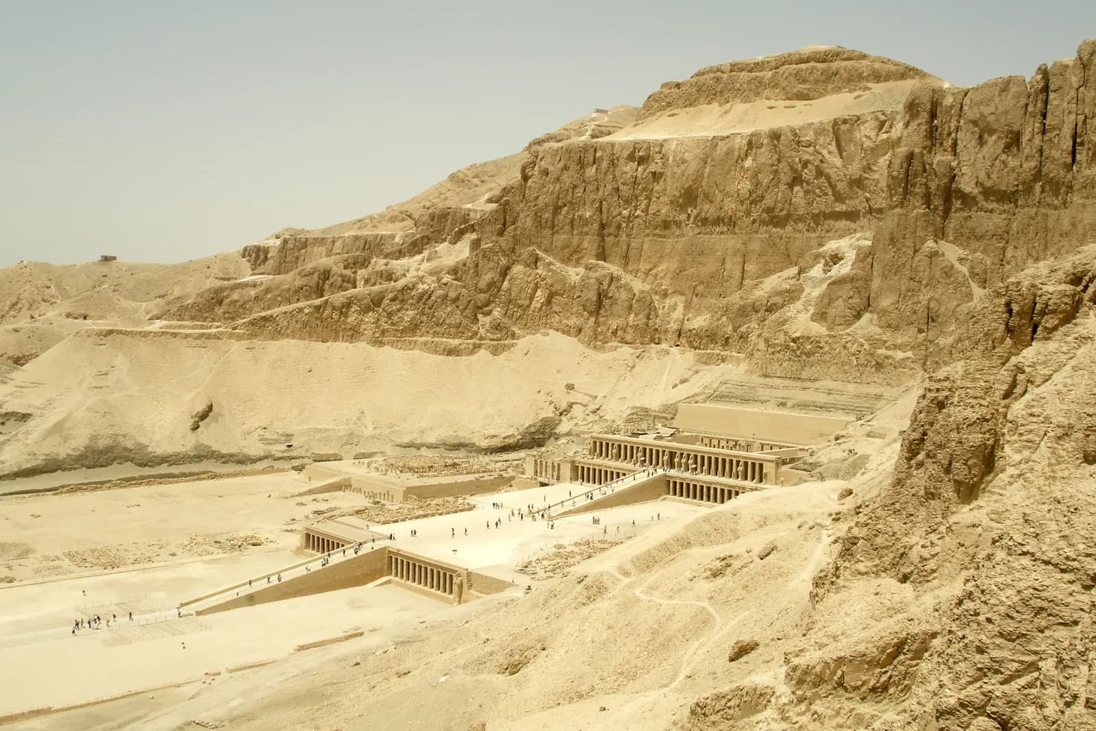 The terraced mortuary temple of Hatshepsut rising in colonnaded tiers against the sheer cliffs of Deir el-Bahari.