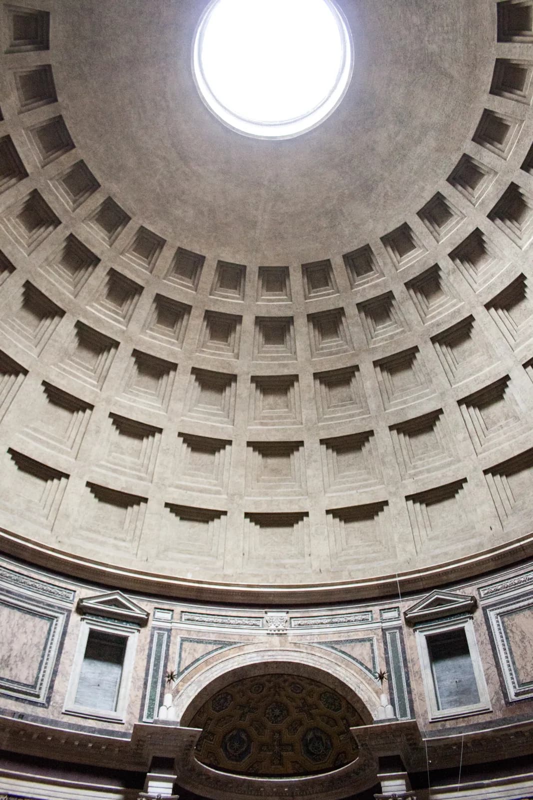 Interior of the Pantheon in Rome — view from below the coffered dome looking up at the central oculus.