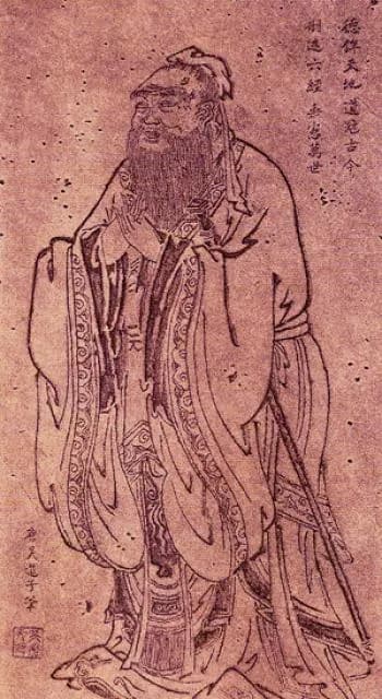 The traditional standing portrait of Confucius after Wu Daozi — the sage in robes, hands clasped, a sword at his side, in the canonical Chinese image of the Master.