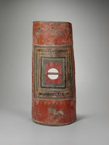 Curved rectangular shield of laminated wood with painted decoration including a lion and winged victories.