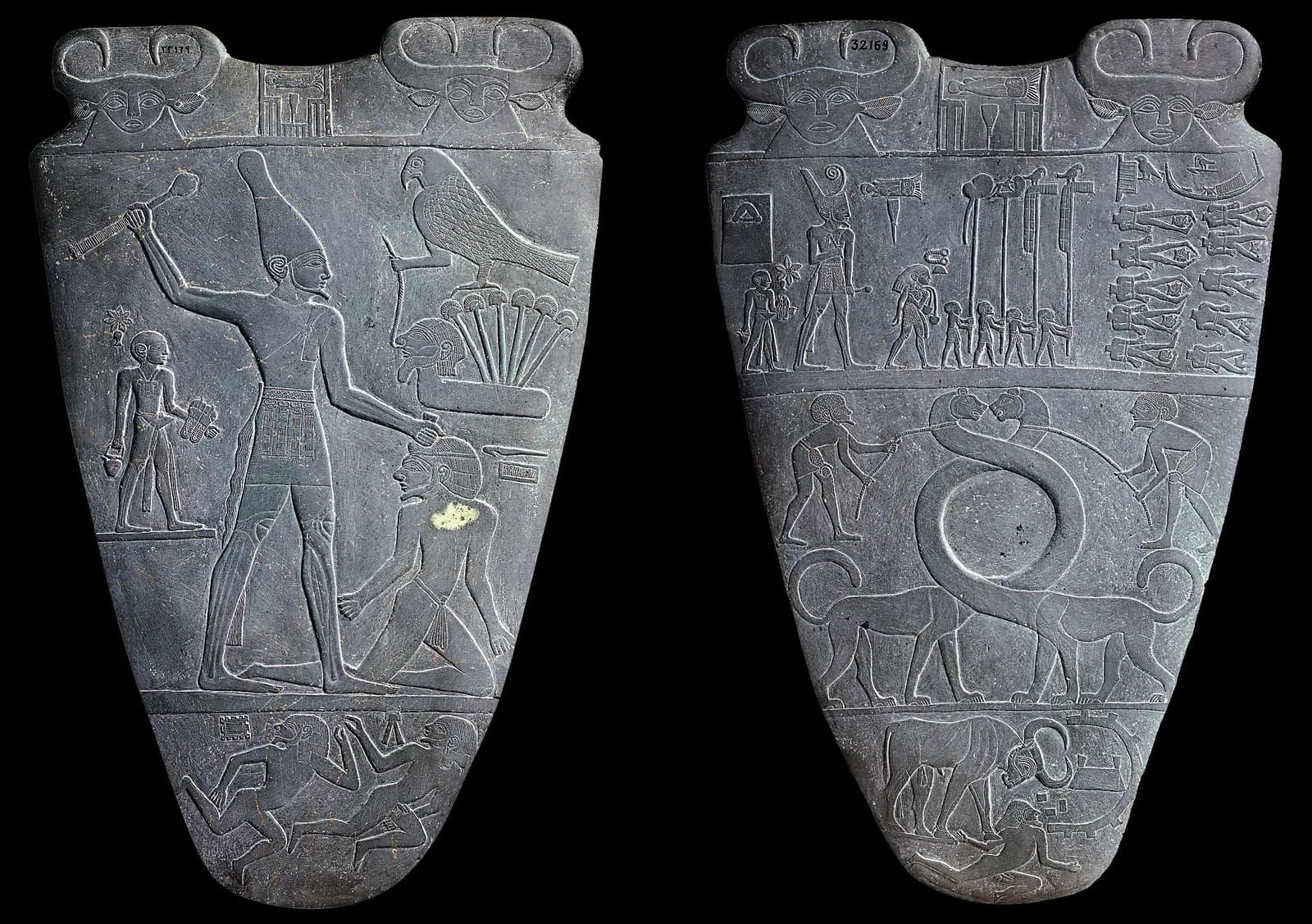 The Narmer Palette, a carved slate ceremonial palette showing the king Narmer in the white crown smiting an enemy — one of the founding documents of the Egyptian state.